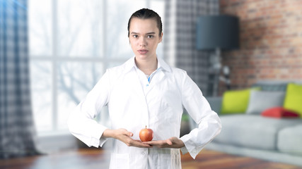 Beautiful medical woman doctor in uniform. Studio painted background. Concept of profitable health care.