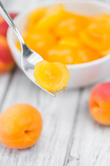 Pickled Apricots (selective focus) on vintage wooden background