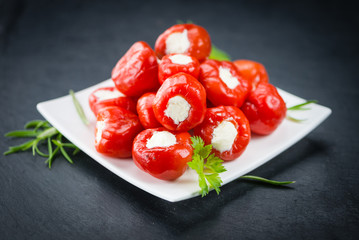 Some Filled Pimientos on a dark slate slab