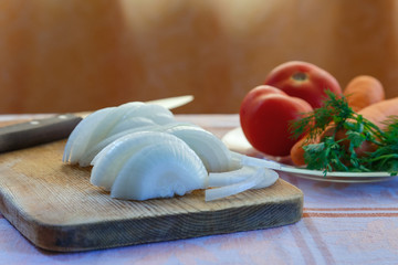 Chopped onions on wooden board