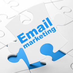 Business concept: Email Marketing on puzzle background