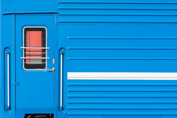 Window and door of the blue locomotive wagon.