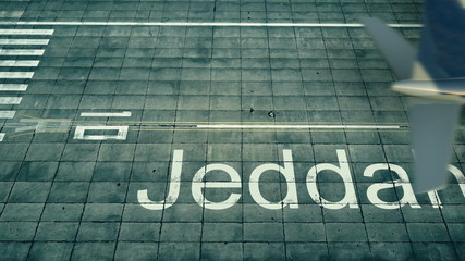 Fototapeta na wymiar Aerial view of an airplane arriving to Jeddah airport. Travel to Saudi Arabia 3D rendering