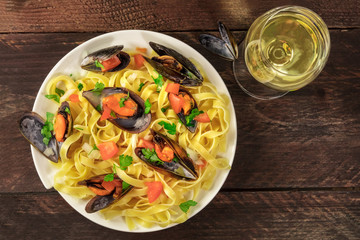 Seafood pasta with mussels, shrimps, and white wine