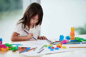 Cute Little Girl Focused on Drawing