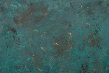 Close-up view of dark grunge scratched turquoise textured background