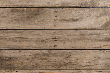 Fototapeta na wymiar Top view of brown rustic wooden background with horizontal planks