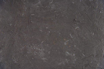 Fototapeta na wymiar Close-up view of dark grunge scratched textured background