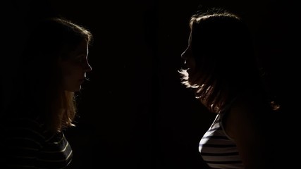 Two girls angry with each other. Anger, quarrel, violence. Unhappy mother and daughter or two sisters, family issues.