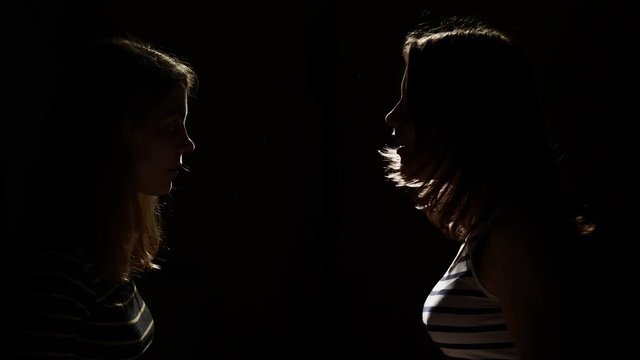 Two girls angry with each other. Anger, quarrel, violence. Unhappy mother and daughter or two sisters, family issues.