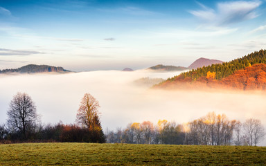 Morning mist defiling the valley in a mountainous country in northern Slovakia