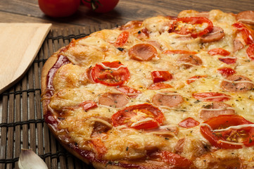 Delicious fresh pizza served on wooden table