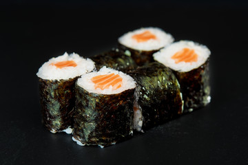 Sushi on black background. Perfect for creating sushi restaurant menu. Part of series.