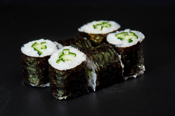 Sushi on black background. Perfect for creating sushi restaurant menu. Part of series.