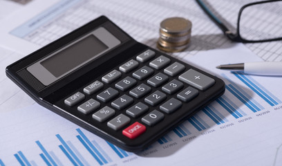 Calculator on financial documents, accounting concept