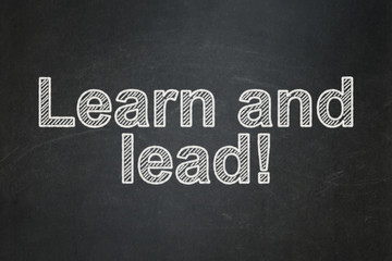 Learning concept: Learn and Lead! on chalkboard background