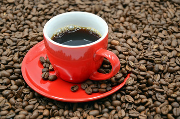 coffee cup with many coffee beans photo