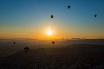 Hot air balloon flying over spectacular Cappadocia