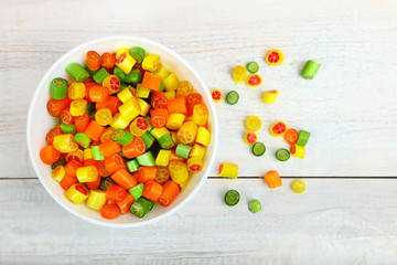 A bowl with caramel lollipops