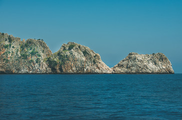 Fototapeta na wymiar Rocks of cape Cilvarda in Alanya, Mediterranean Turkey. View from sea