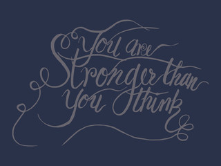 You are stronger than you think quoter by hand draw calligraphy on dark background