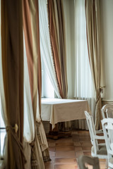 Fototapeta na wymiar Empty table and chairs in luxury restaurant
