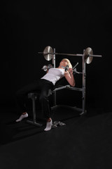 Obraz na płótnie Canvas woman making exercise at the gym