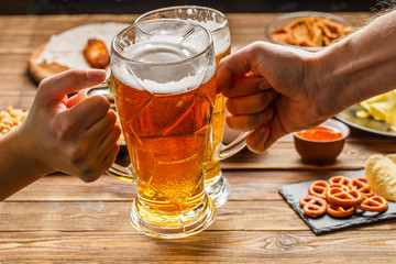 Appetizers and beer on the table for watch the football match.
