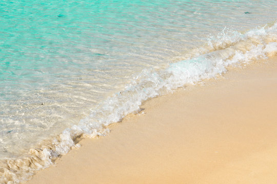 Beautiful transparent seashore with sea foam, italian beach in Salento, natural marine background