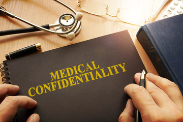 Document with name medical confidentiality on a table.