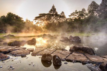 Mineral hot water in hot springs and morning fog background at Chae Son National Park, the park is...