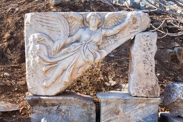 Classic White Roman angel bas-reflief wall decoration in Temple Door with stone statue in ephesus Archaeological site in turkey