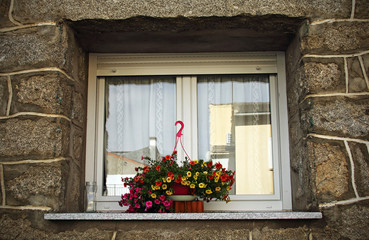 Fototapeta na wymiar Window in a stone house