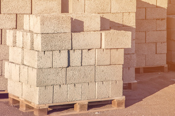 pallet of cinder block with the concept of selling building materials , construction of houses.