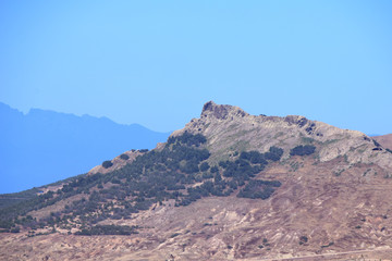 Pico de Ana Ferreira Mountain, Porto Santo Island with the mountains of Madeira in silhouette in the background, Portugal