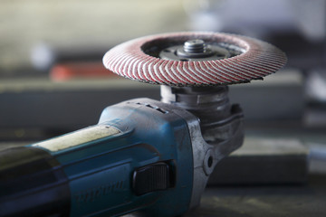 A grinder on a factory table