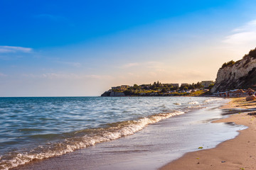 Black sea coast with sand beach in Bulgaria, at suset, summer sea rest concept