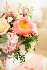 Beautiful decoration on wedding table with roses in bouquet