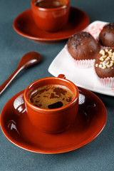 Still-life with a cup of coffee and cakes
