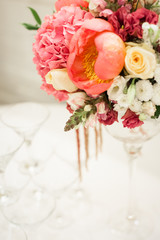 Beautiful decoration on wedding table with roses in bouquet
