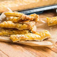 Homemade Cheesy Breadsticks from yeast dough with Spices (garlic, dill, sesame)
