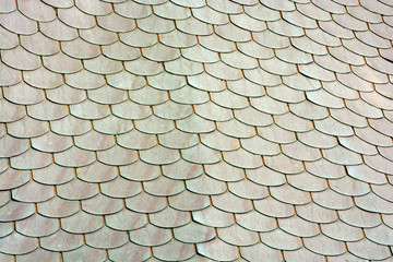 Metal roof tiles. Patina on the shingles. Background pattern.