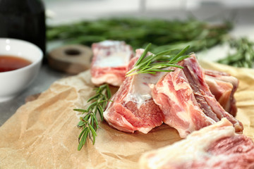 Raw ribs on parchment paper