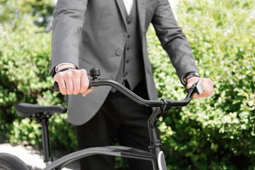 Young man with bicycle in park