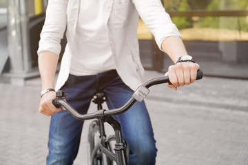 Young man with bicycle outdoor