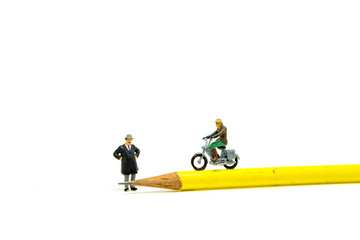 Miniature people,the boss looking at employer riding on yellow pencil isolated on white background using as business concept