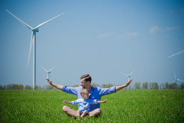 Dad tells his young son about wind generators