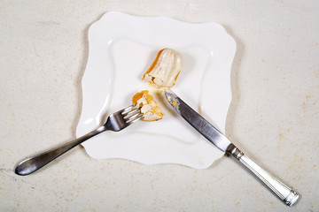 Top view of eating eclair cake, on white background.