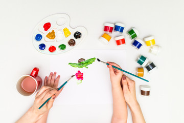 Child painting a flower