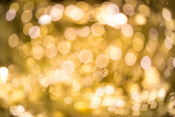 blurred lights with bokeh effect golden background